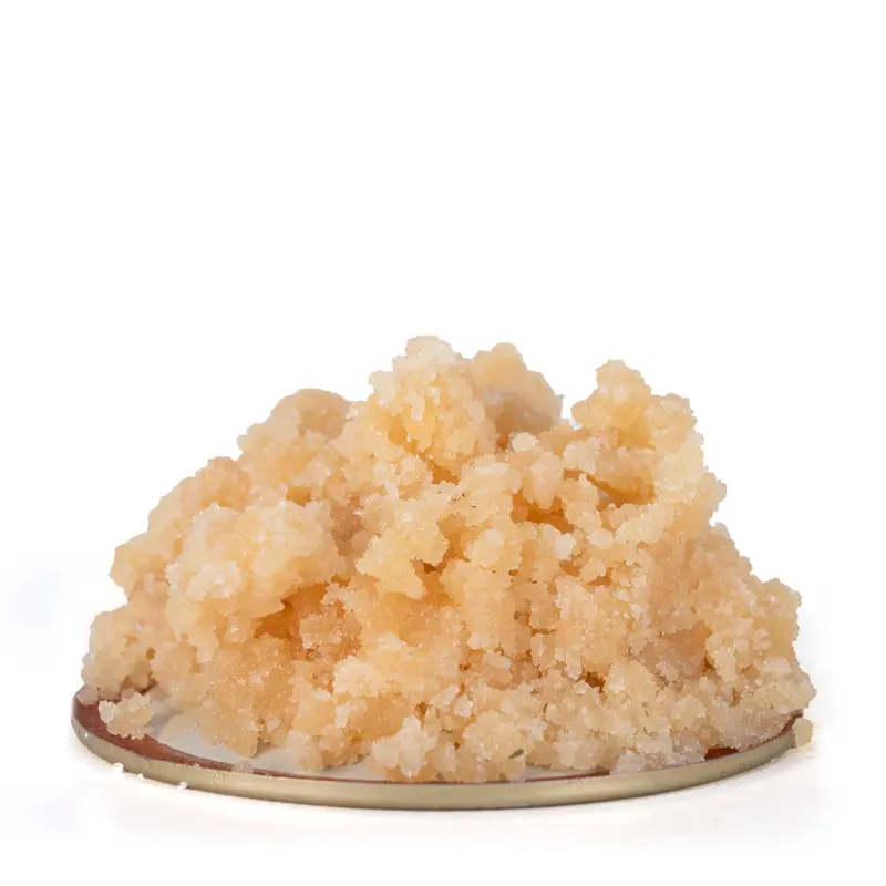 Hawaiian Pink Punch live resin with a shimmering crystalline structure Hawaiian Pink Punch live resin with a shimmering, crystalline structure