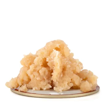 Pink Bruce Banner Kush live resin with a luminous yellow hue